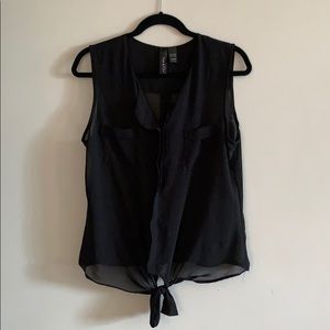 Black sheer sleeveless blouse.